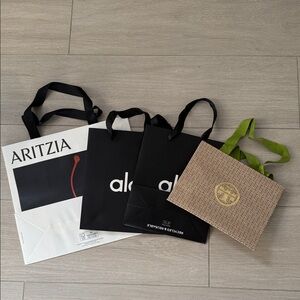 Tory Burch Alo Aritzia shopping bags